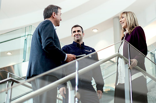 Three airport executives having a discussion inside the airport